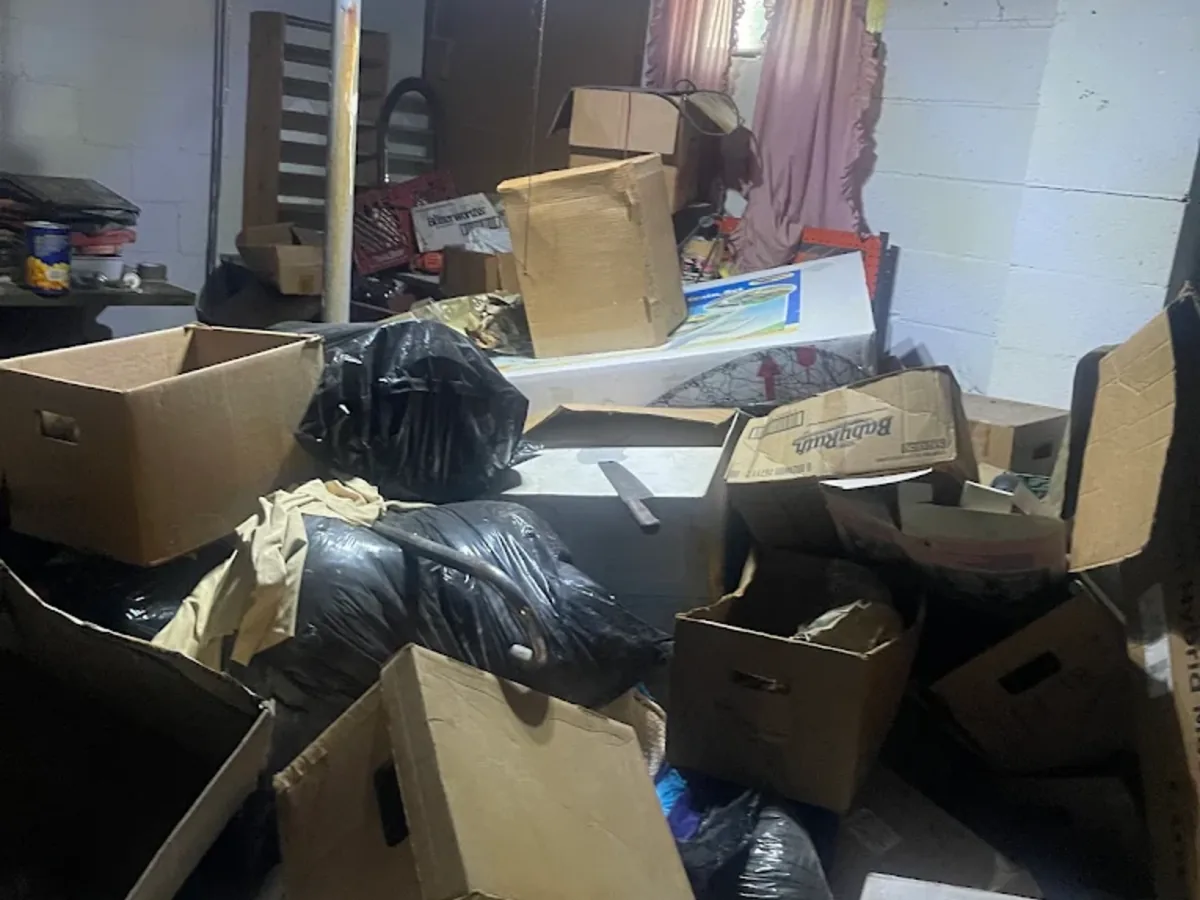 Cardboard boxes and trash bags collected for removal