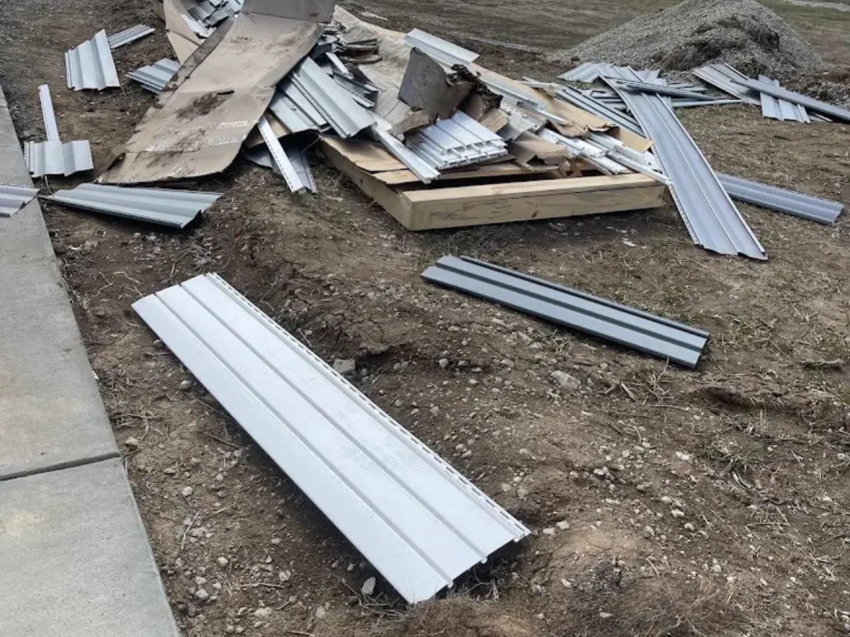 Post construction metal trim scraps cleared from a lot